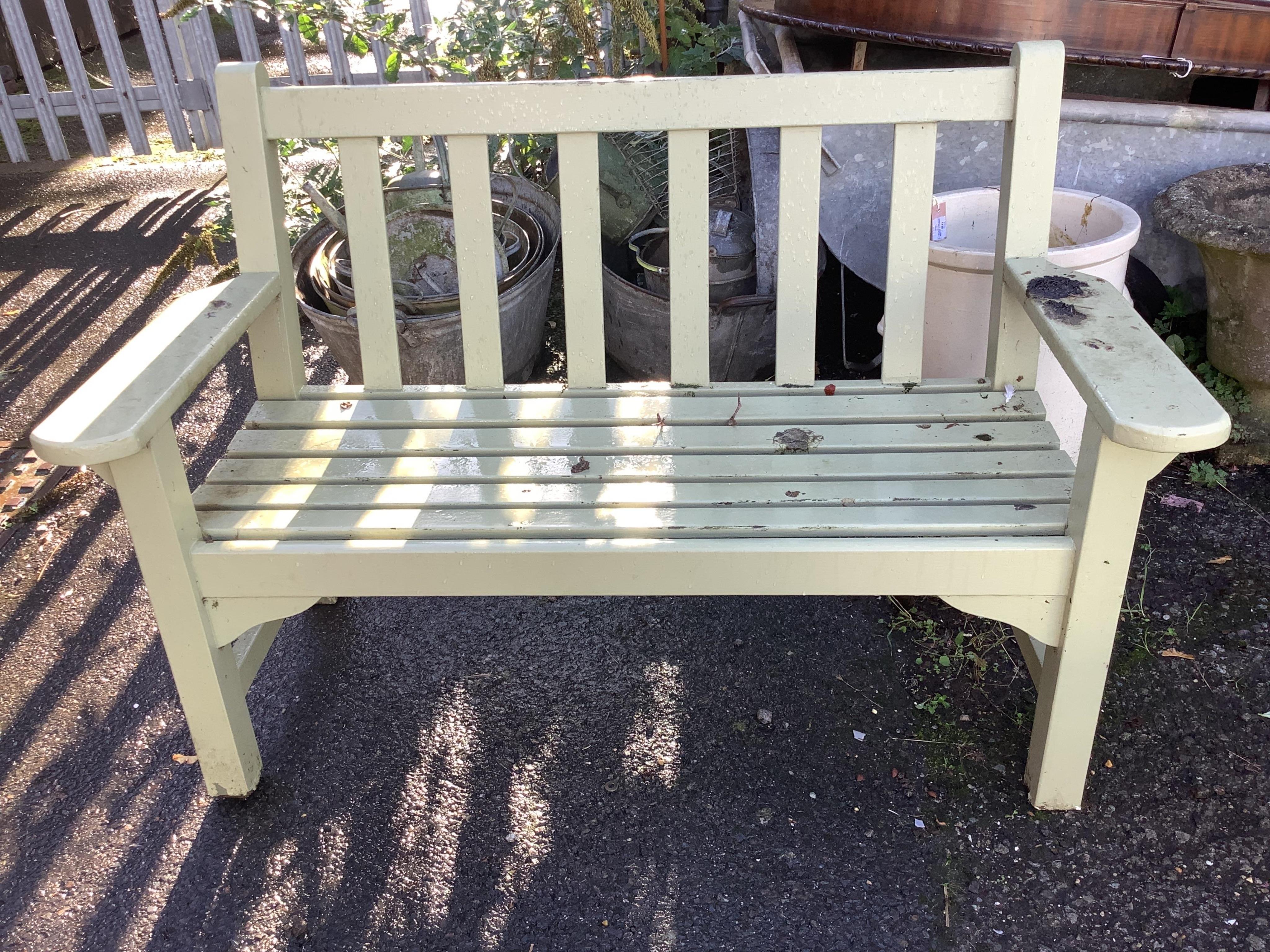 A pale green painted slatted garden bench, width 132cm, depth 62cm, height 89cm. Condition - fair